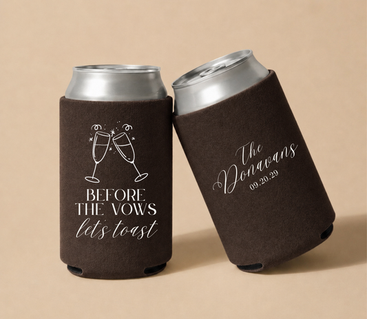 Dark brown personalized foam wedding can coolers featuring champagne toast artwork, "Before the Vows Let's Toast" design, custom Donovan family name, and wedding date September 20, 2029.