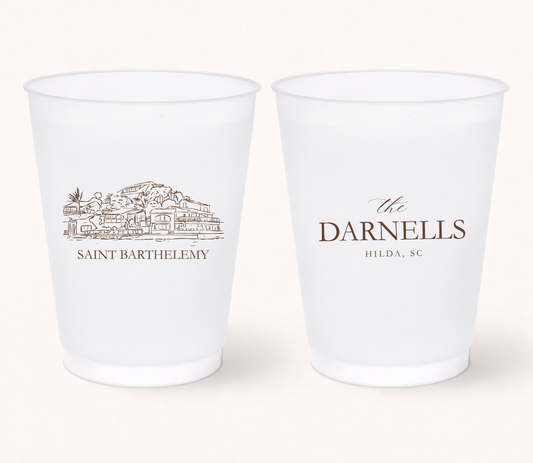 Personalized destination wedding frosted cups featuring a custom resort illustration, family name, and wedding location for elegant destination wedding celebrations.