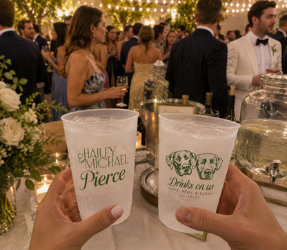 Reusable frosted plastic wedding cups featuring two illustrated dogs and personalized reception details.
Dog lover wedding frosted cups with custom pet artwork, couple names, and signature drink design.
Personalized reception cups featuring two custom dog illustrations and elegant wedding typography.