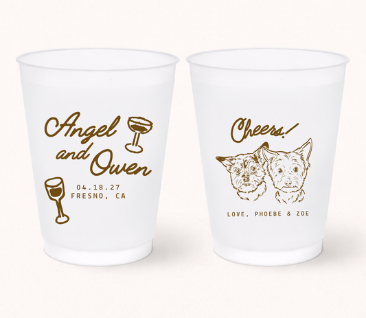 Personalized frosted wedding cups featuring two custom illustrated dog portraits with couple names, wedding date, and pet names for pet-friendly wedding celebrations.