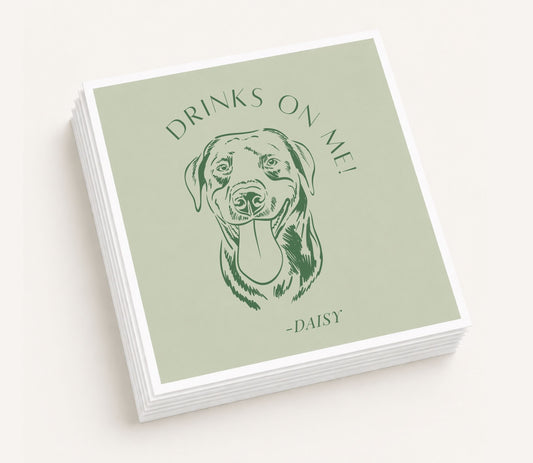 Sage green personalized wedding table napkin featuring a custom illustrated dog portrait, "Drinks on Me!" wording, personalized pet name Daisy, and premium paper construction.
Personalized wedding table napkin featuring a custom dog portrait with Drinks on Me design.
Custom dog portrait wedding table napkin with personalized pet name and sage green background.