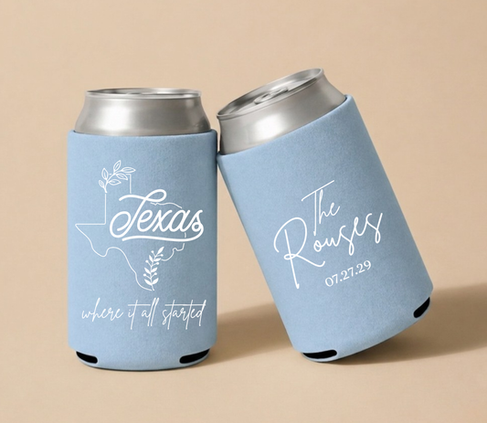 Light blue personalized wedding can coolers featuring a Texas state outline, custom couple's names, and wedding date.