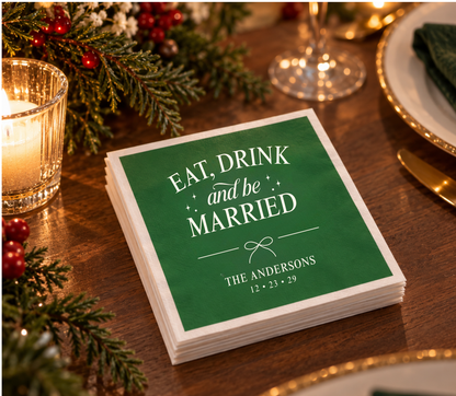 Personalized holiday wedding napkins with classic green background, white lettering, and festive bow design.
