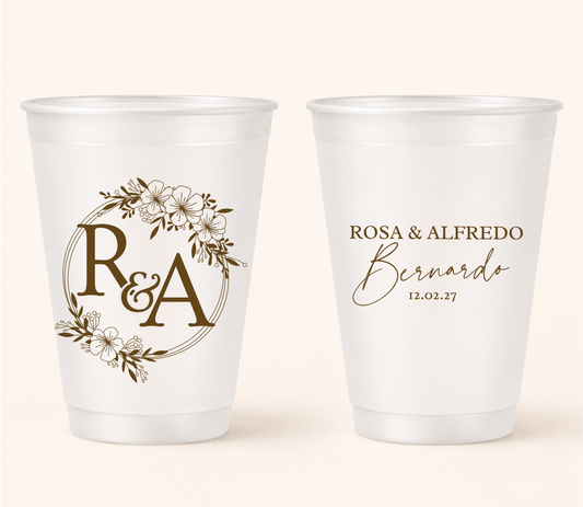 Custom floral frosted wedding cups with personalized initials, couple names, and wedding date for reception bars