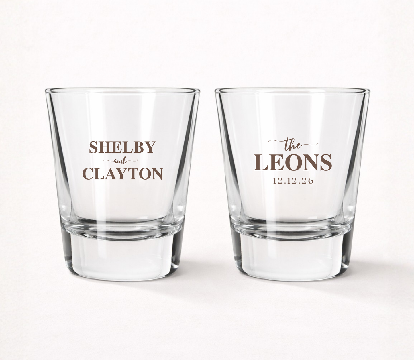 Personalized Leons wedding shot glasses featuring custom couple names, family name, and wedding date in a timeless classic design.