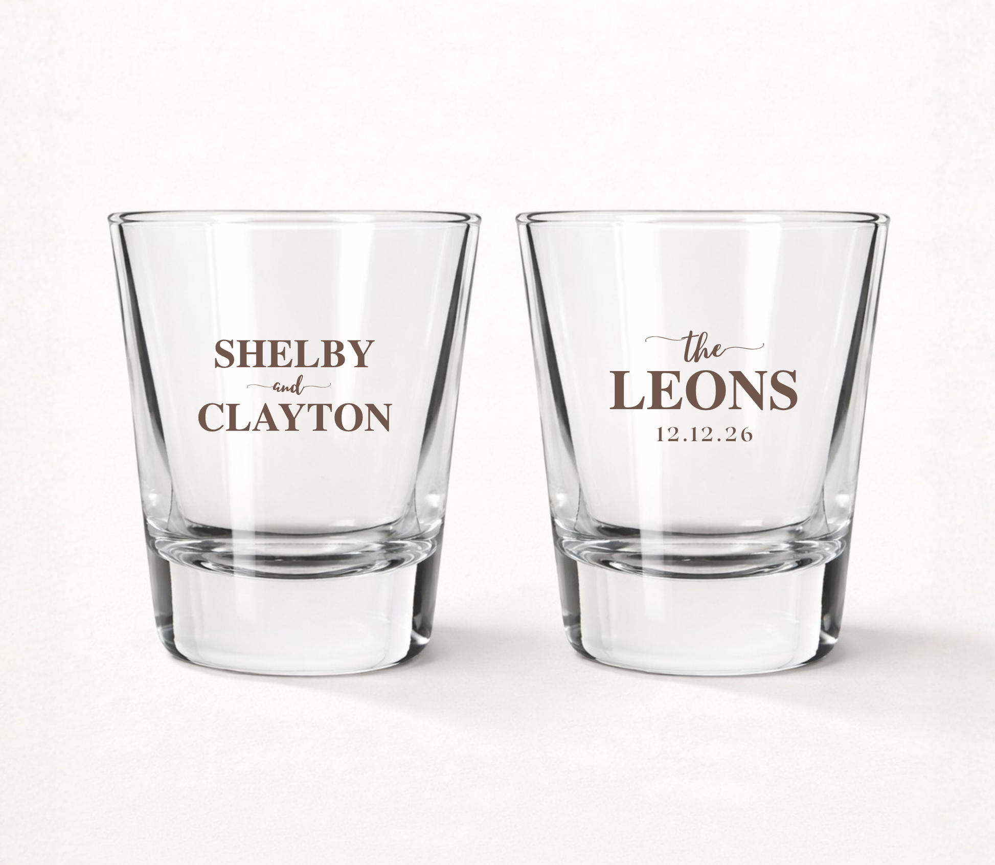 Personalized Leons wedding shot glasses featuring custom couple names, family name, and wedding date in a timeless classic design.