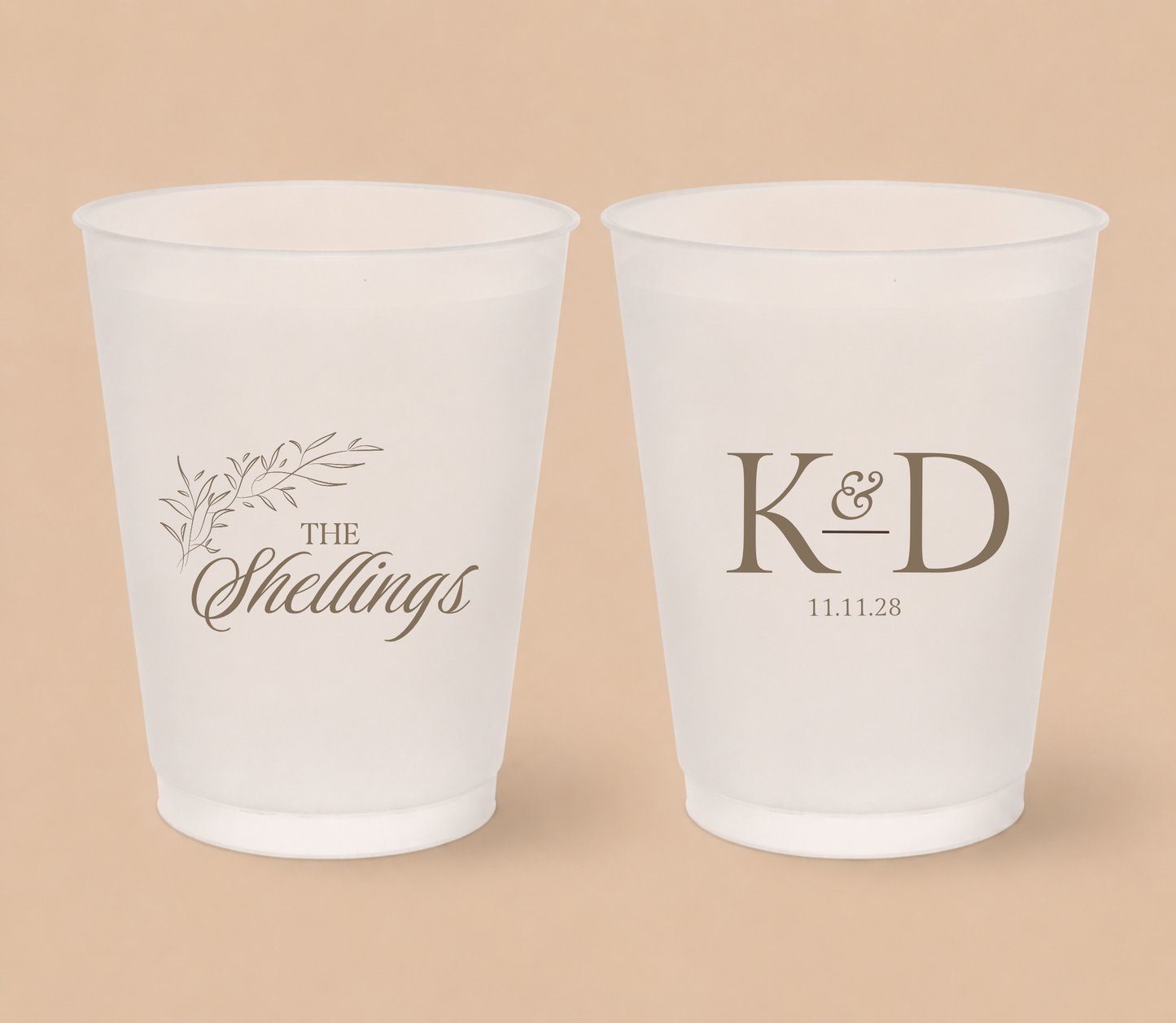 White frosted wedding cups featuring a botanical family surname design, custom initials K and D, and personalized wedding date.