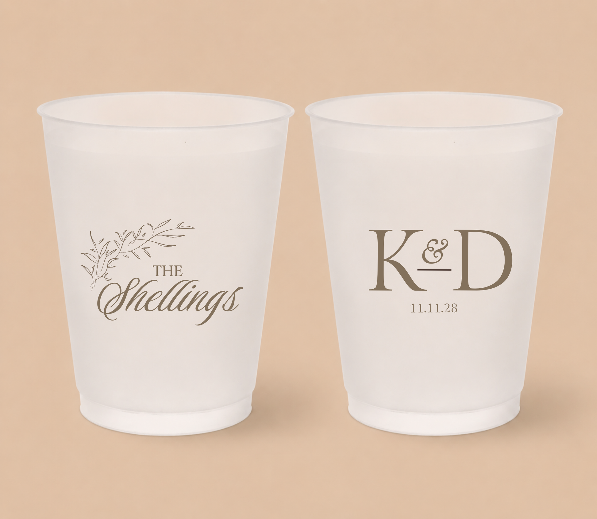 White frosted wedding cups featuring a botanical family surname design, custom initials K and D, and personalized wedding date.