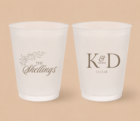 White frosted wedding cups featuring a botanical family surname design, custom initials K and D, and personalized wedding date.
