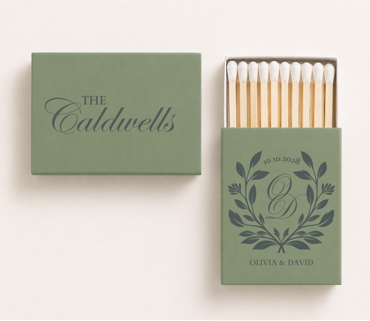 Sage green personalized wedding matchboxes featuring the Caldwells family surname, botanical monogram with initials O and D, custom couple names Olivia and David, and wedding date.

Personalized sage green wedding matchbox featuring botanical monogram and custom surname.

Custom botanical wedding matchbox with couple names, monogram, and wedding date.