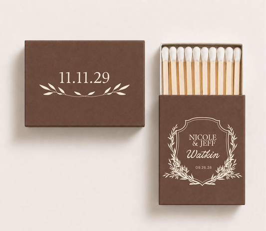 Brown personalized wedding crest matchboxes featuring custom couple names Nicole and Jeff, Watkin family surname, botanical crest, and wedding date.

Brown personalized wedding matchbox featuring an elegant botanical crest and custom names.

Custom monogram wedding matchbox with botanical frame, surname, and wedding date.