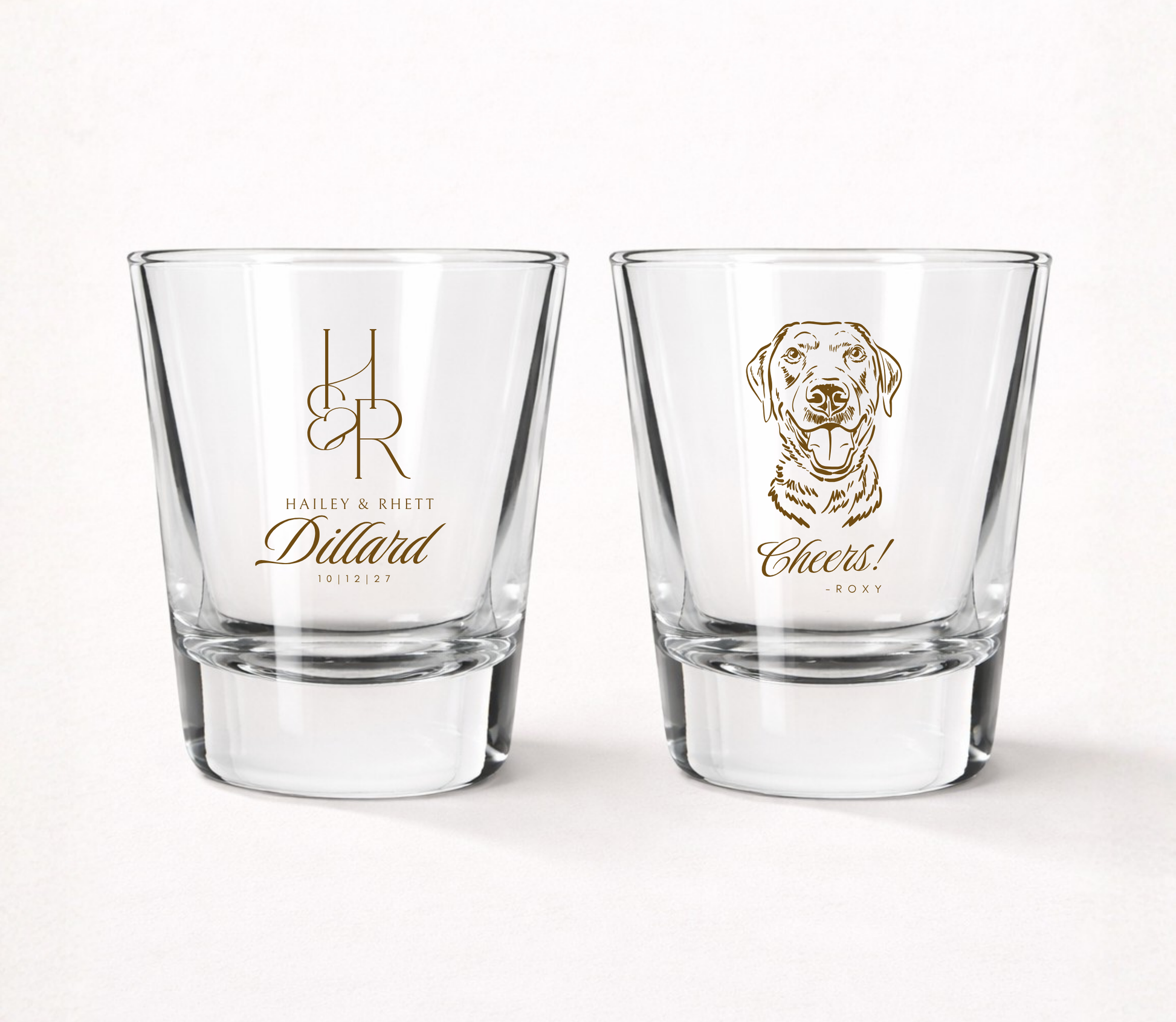 Clear personalized wedding shot glasses featuring a custom dog portrait, elegant monogram, couple names, and wedding date.