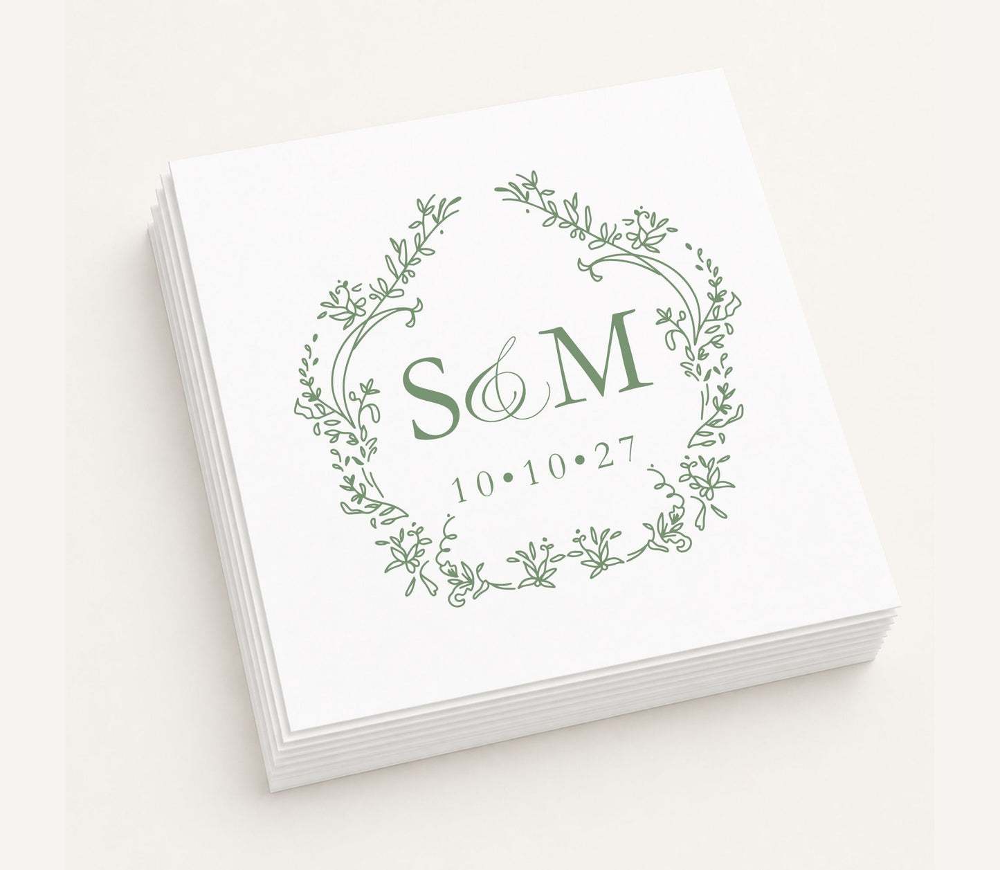 White personalized wedding table napkin featuring an elegant botanical wreath monogram with initials S & M, wedding date 10.10.27, and premium paper construction.
Personalized monogram wedding table napkin featuring a botanical wreath and custom initials.
Elegant wedding table napkin with floral wreath monogram, custom initials, and wedding date.