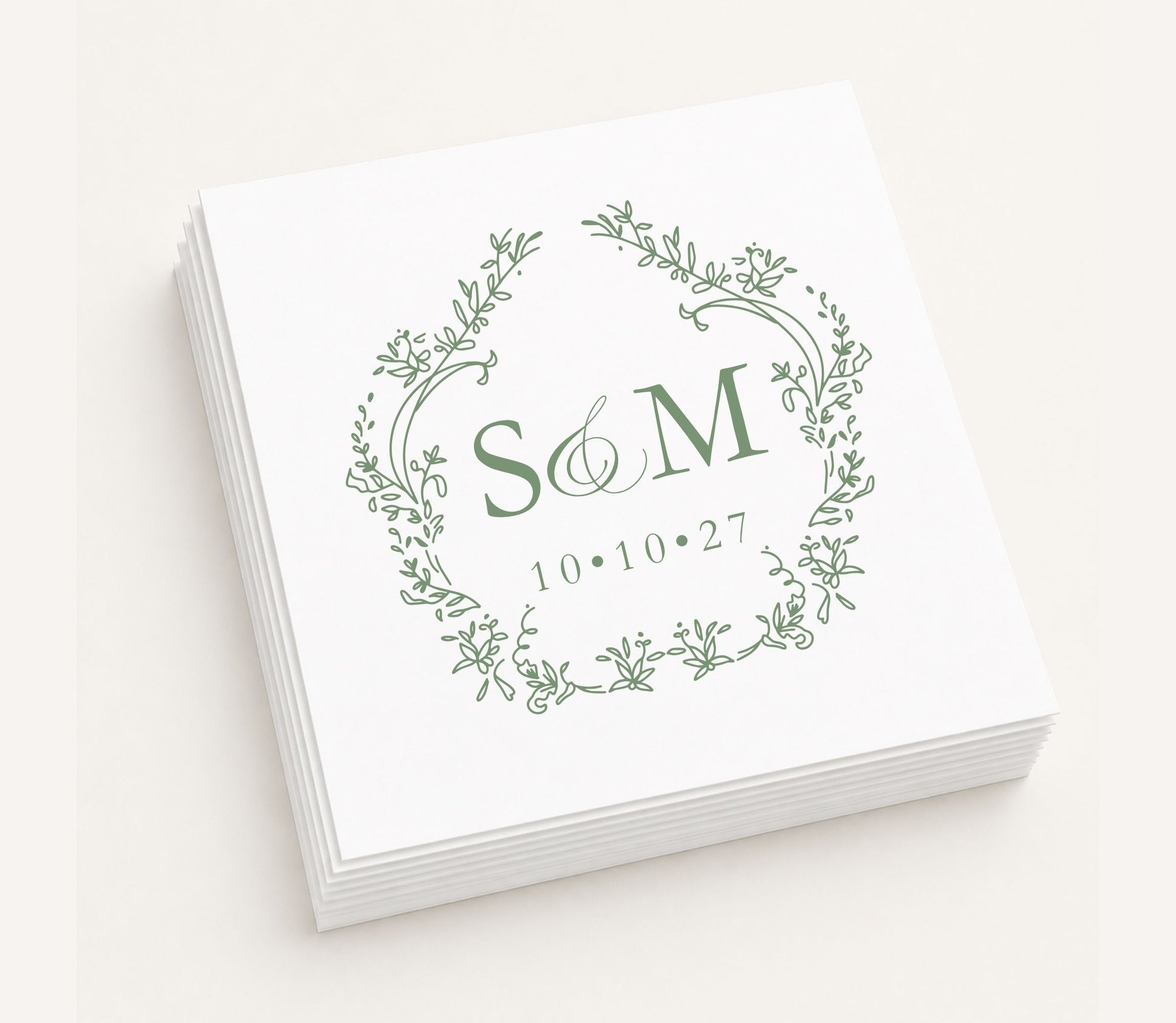 White personalized wedding table napkin featuring an elegant botanical wreath monogram with initials S & M, wedding date 10.10.27, and premium paper construction.
Personalized monogram wedding table napkin featuring a botanical wreath and custom initials.
Elegant wedding table napkin with floral wreath monogram, custom initials, and wedding date.