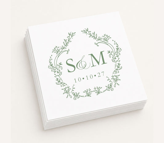 White personalized wedding table napkin featuring an elegant botanical wreath monogram with initials S & M, wedding date 10.10.27, and premium paper construction.
Personalized monogram wedding table napkin featuring a botanical wreath and custom initials.
Elegant wedding table napkin with floral wreath monogram, custom initials, and wedding date.