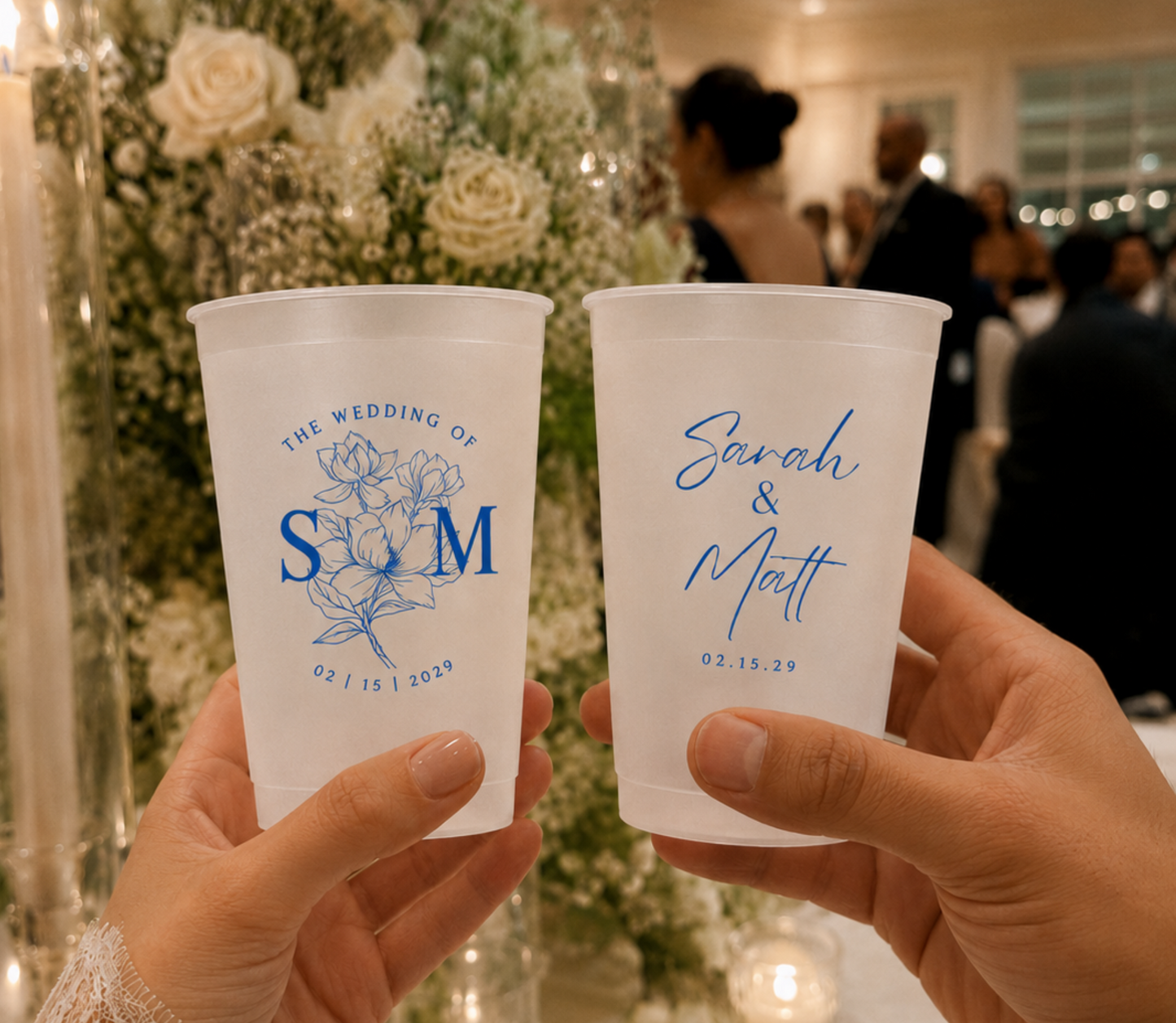 Elegant frosted plastic wedding cups with custom couple names, initials, and blue floral design for reception guests