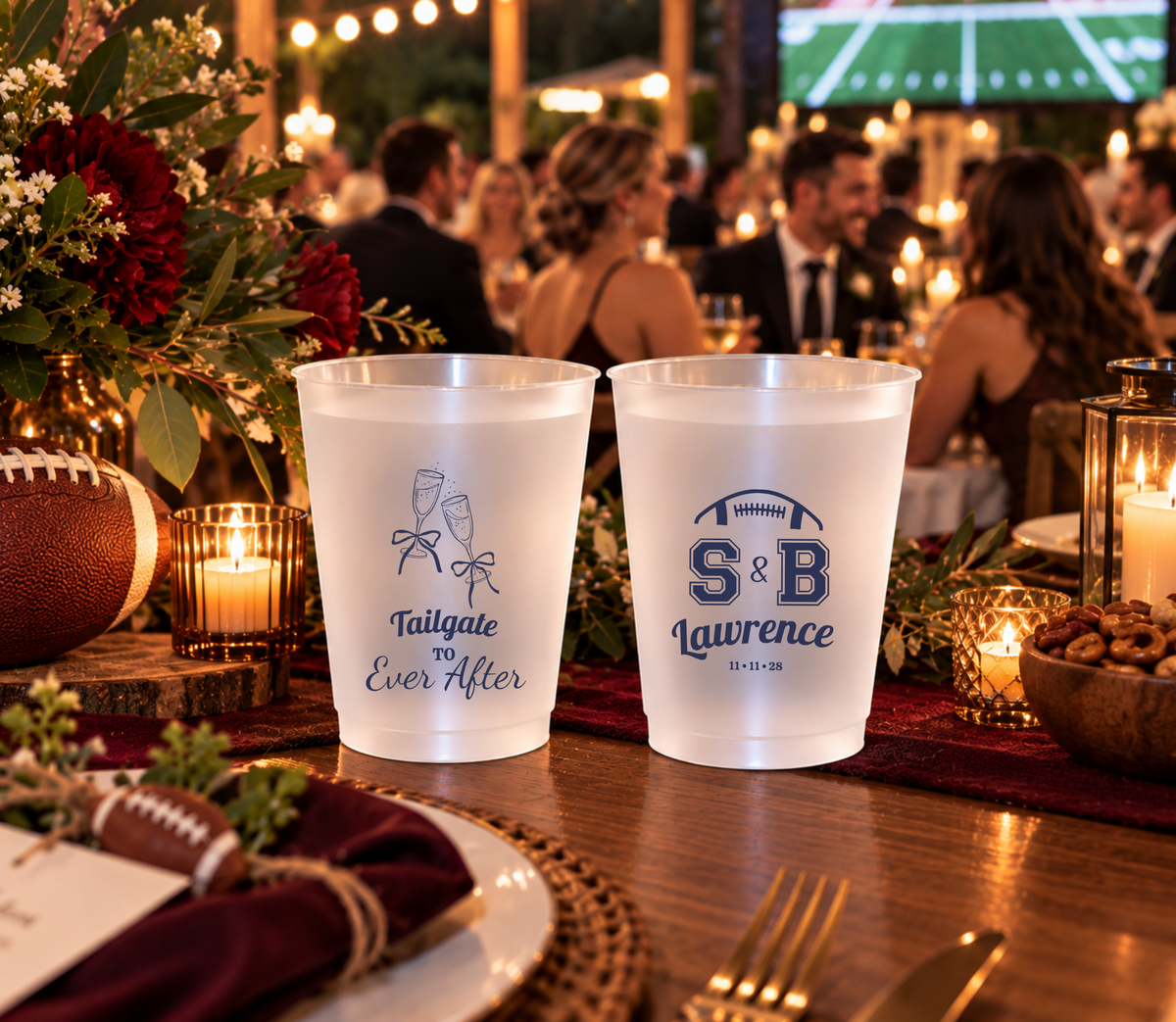 Personalized sports wedding cups with football-inspired initials, navy lettering, surname, and wedding date.