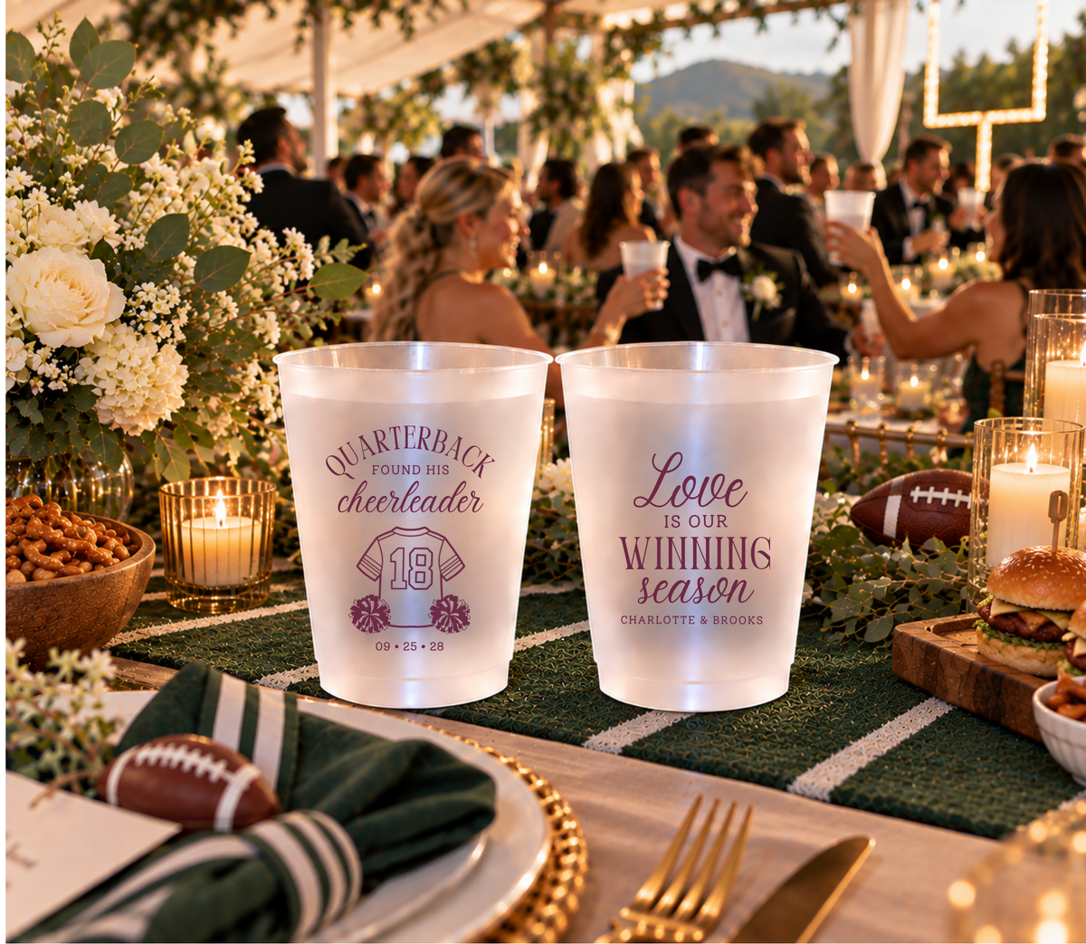 Personalized quarterback and cheerleader wedding cups with football jersey artwork, pom-poms, couple names, and a wedding date.