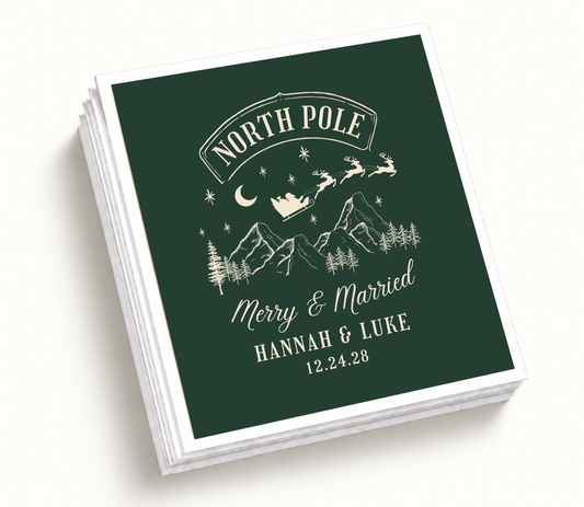 Personalized North Pole Christmas wedding napkins featuring forest green background, ivory mountain and Santa sleigh artwork, custom couple names, and wedding date.