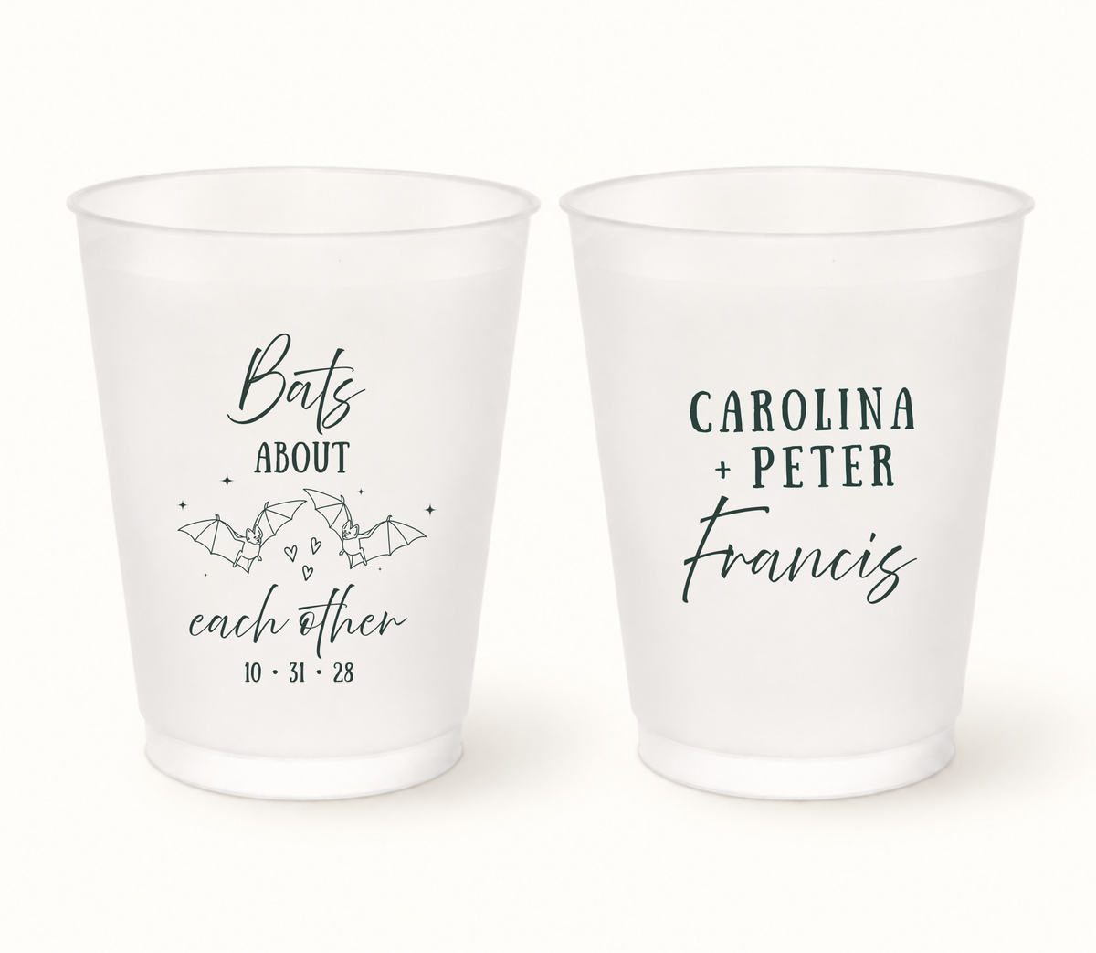 Personalized Bats About Each Other frosted Halloween wedding cups featuring deep green bat illustrations, hearts, Carolina and Peter Francis names, and wedding date 10.31.28.