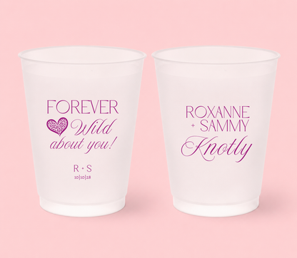 Personalized frosted wedding cups featuring magenta Forever Wild About You lettering, leopard print heart, Roxanne and Sammy names, Knotly surname, initials, and 10-10-28 wedding date.