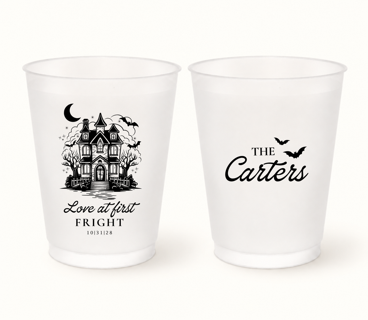 Personalized Love at First Fright Halloween wedding frosted cups featuring a black haunted house illustration, bats, couple surname, and wedding date.
