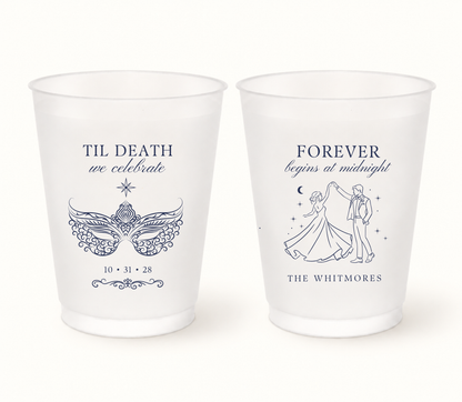 Personalized frosted Til Death We Celebrate masquerade wedding cups featuring navy ornate mask artwork, dancing bride and groom, Whitmores surname, and wedding date 10.31.28.