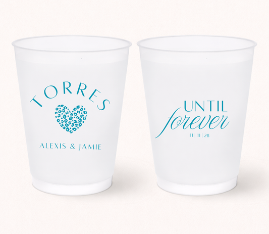 Personalized frosted wedding cups featuring teal blue Until Forever lettering, leopard print heart, Alexis and Jamie names, and 11-11-28 wedding date.
