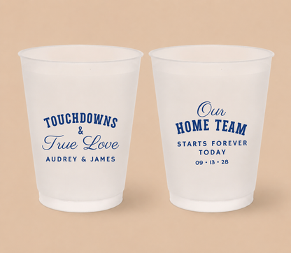 Personalized Touchdowns & True Love football wedding cups featuring royal blue athletic lettering, elegant script, custom couple names, and Home Team wording.