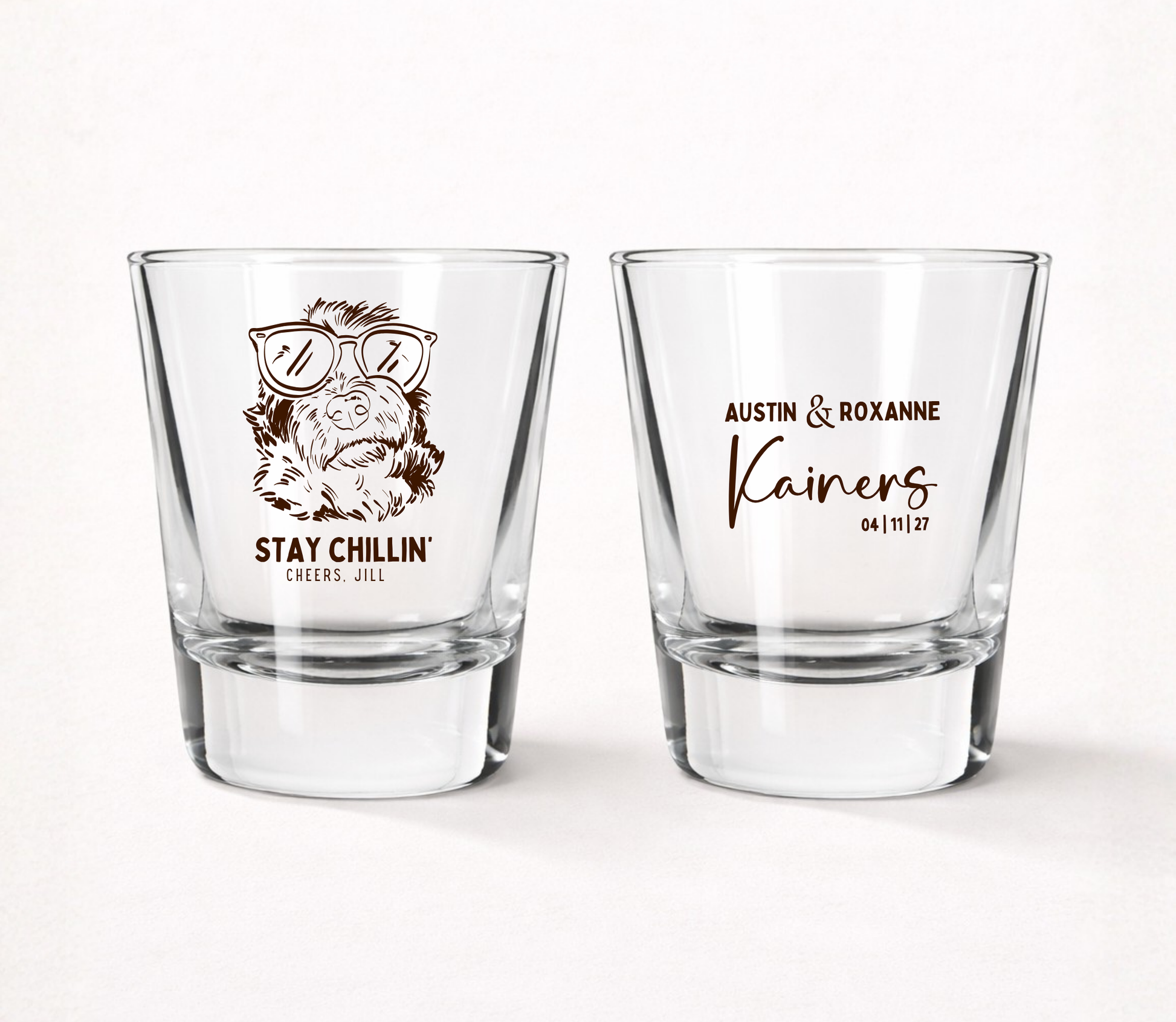 Clear personalized wedding shot glasses featuring a funny dog portrait wearing sunglasses, custom couple names, and wedding date.