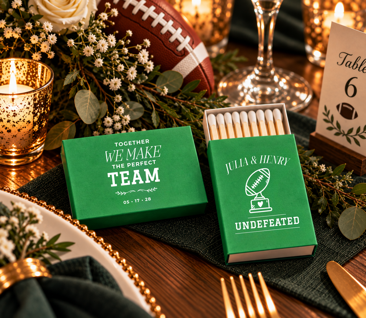 Custom sports wedding matchboxes featuring a football trophy with heart artwork, personalized couple names, and Undefeated wording.
