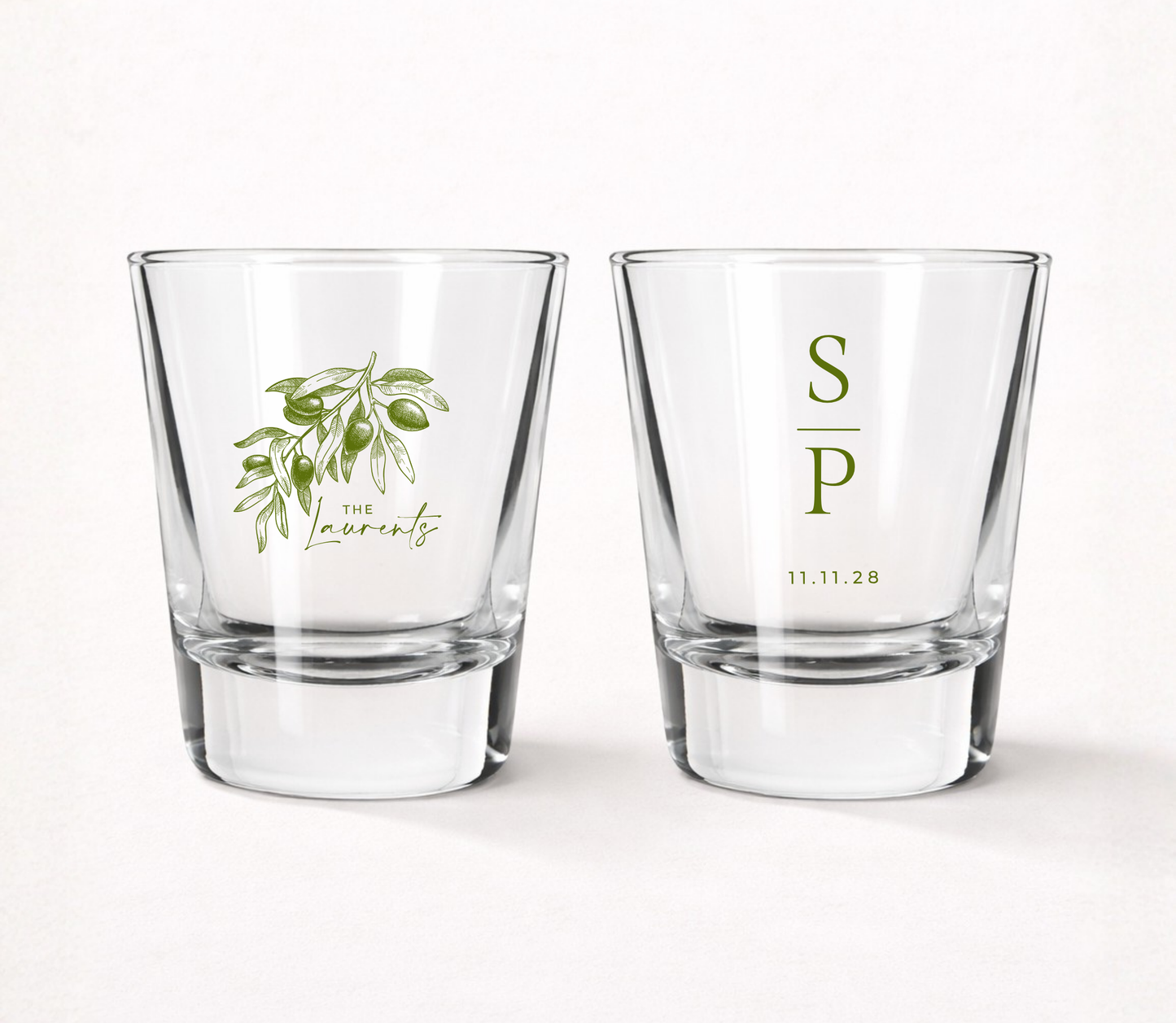 Personalized Olive Branch wedding shot glasses featuring a custom family name, couple initials, wedding date, and elegant olive branch illustration.