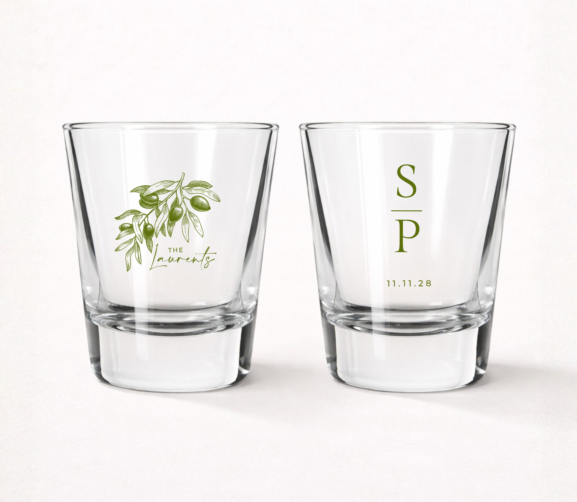 Personalized Olive Branch wedding shot glasses featuring a custom family name, couple initials, wedding date, and elegant olive branch illustration.