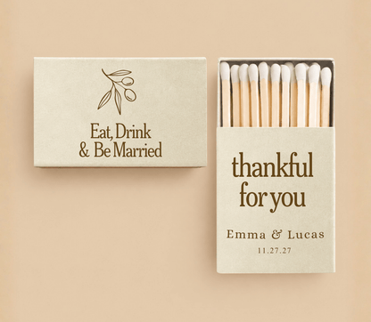 Personalized Thanksgiving wedding matchboxes in ivory featuring botanical artwork, “Eat, Drink & Be Married,” custom names, and thankful wording.
