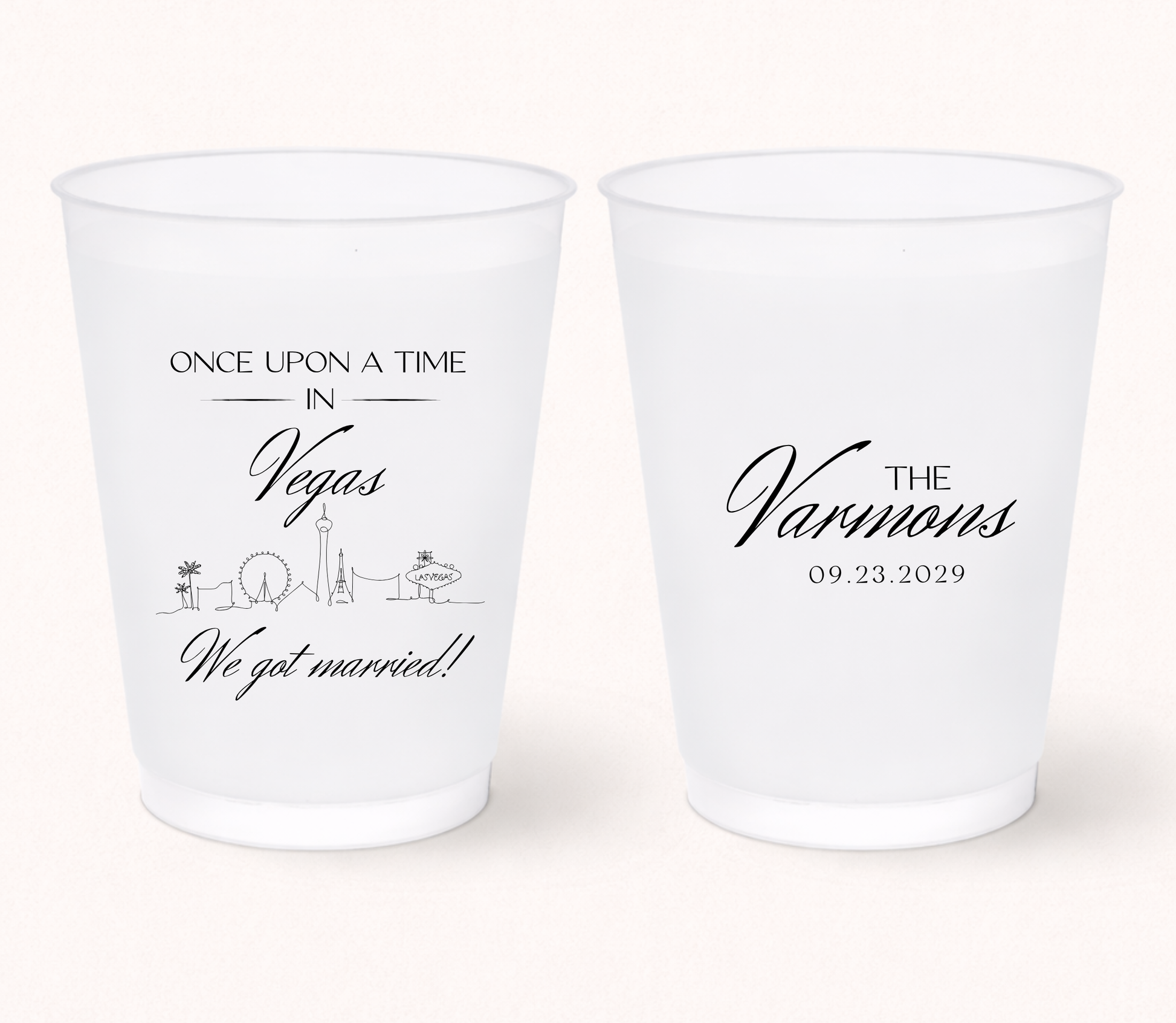 Custom Las Vegas wedding frosted cups with personalized names, destination inspired skyline artwork, and wedding details