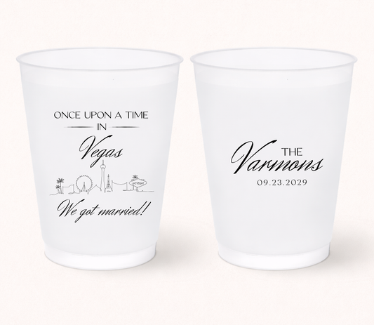 Custom Las Vegas wedding frosted cups with personalized names, destination inspired skyline artwork, and wedding details