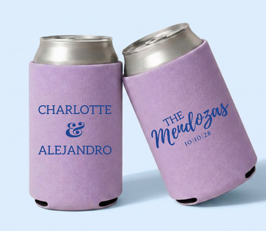 Personalized lavender wedding can coolers featuring Charlotte and Alejandro names in bold blue lettering with The Mendozas family name and October 10, 2028 wedding date.
