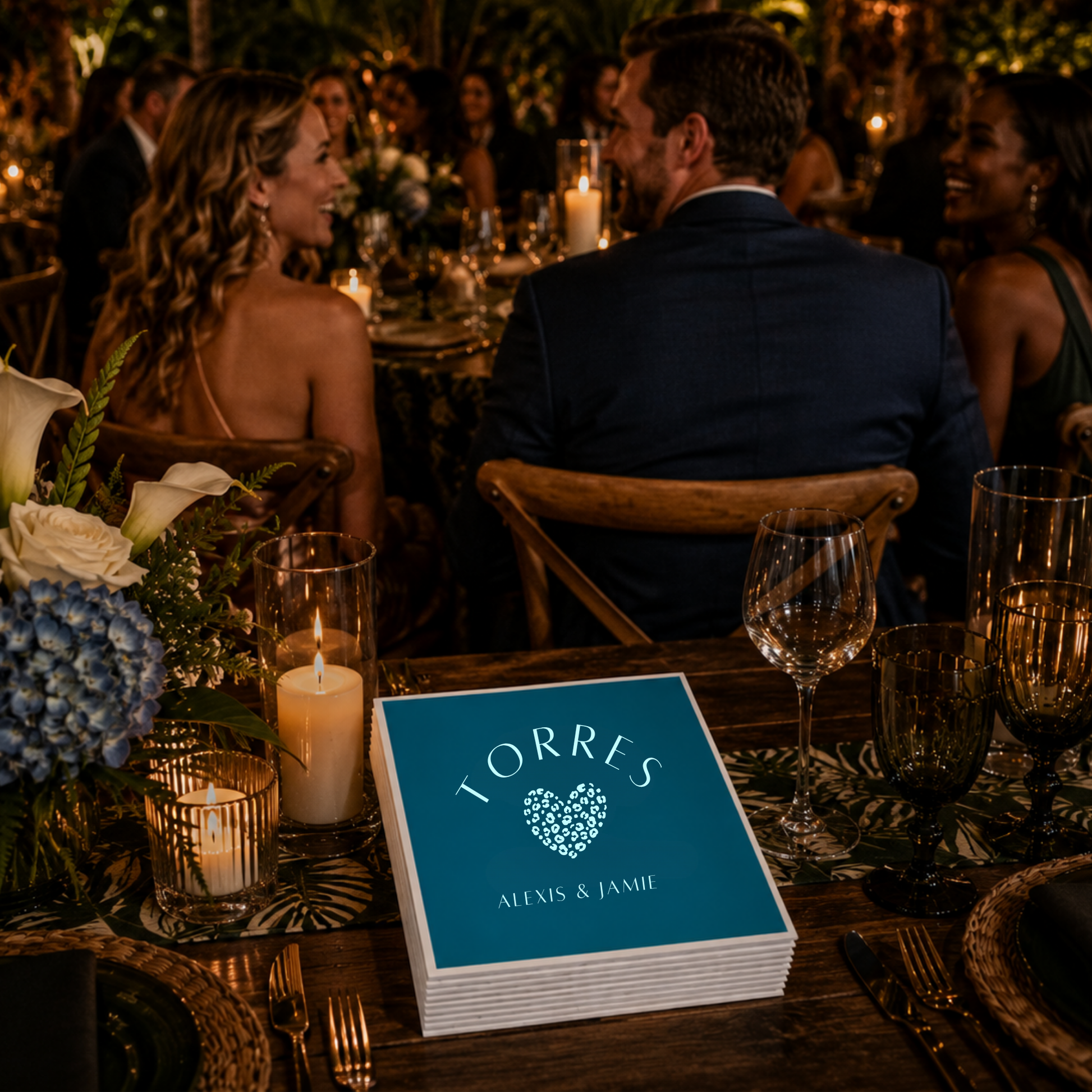 Custom teal wedding napkins with couple names.