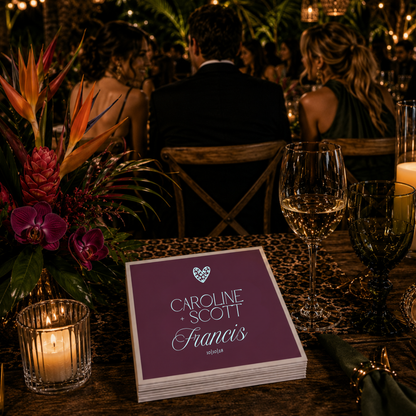 Custom purple wedding napkins with couple names.
