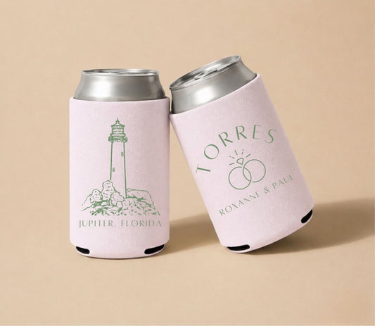 Light pink personalized wedding can coolers featuring a lighthouse illustration, Jupiter Florida coastal design, custom names Roxanne and Paul Torres, and wedding-themed artwork.