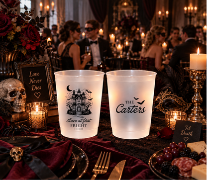 Personalized haunted house wedding frosted cups featuring couple surname and flying bats.