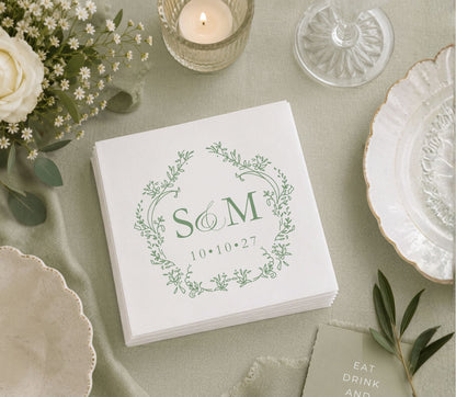 Minimalist botanical wedding table napkin featuring custom initials, floral wreath, and wedding date.