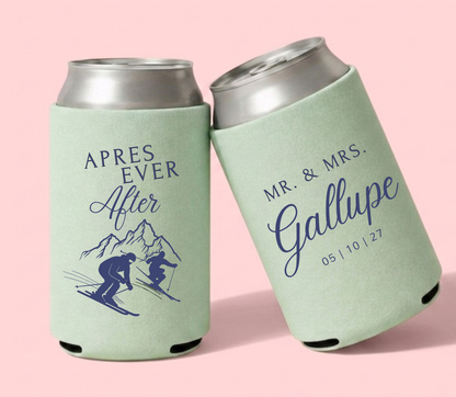 Mint green personalized ski wedding can coolers featuring custom family name, wedding date, and après-ski mountain artwork with skiing couple illustration.