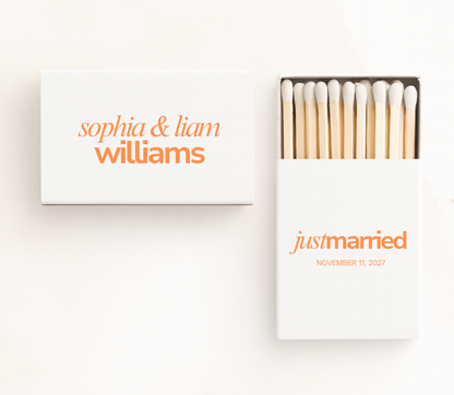 Personalized Just Married wedding matchboxes with custom names, wedding date, and orange typography on white matchboxes