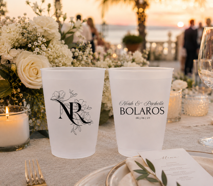 Personalized floral monogram wedding frosted cups featuring botanical artwork custom names family name and wedding date
