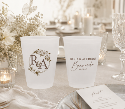 Personalized floral monogram wedding frosted cups featuring custom initials floral wreath artwork couple names and wedding date
