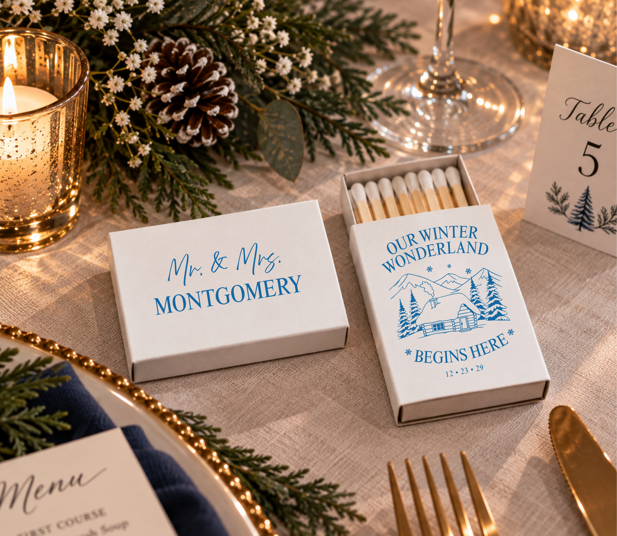 Personalized winter wedding favors featuring blue winter landscape, cabin illustration, custom names, and wedding date.