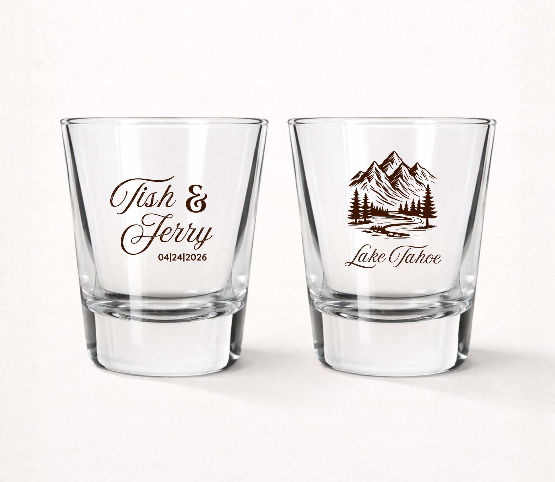 Personalized clear wedding shot glasses featuring a scenic mountain landscape with custom couple names and wedding date for mountain weddings.