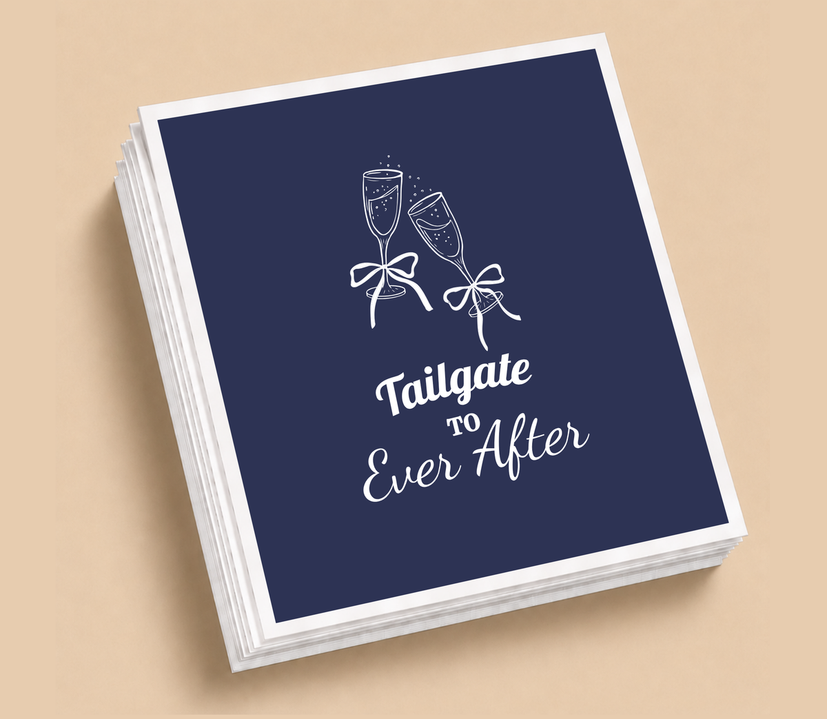 Personalized Tailgate To Ever After football wedding napkins featuring champagne glasses with bows and elegant white lettering on navy blue.
