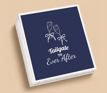 Personalized Tailgate To Ever After football wedding napkins featuring champagne glasses with bows and elegant white lettering on navy blue.